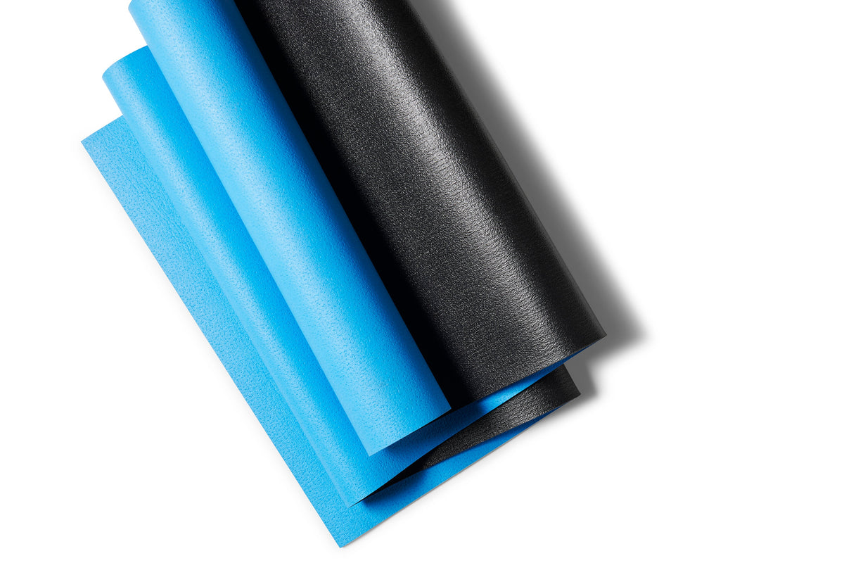 Original folded light-blue YOUBYOU yoga mat with black underside – Onyx edition